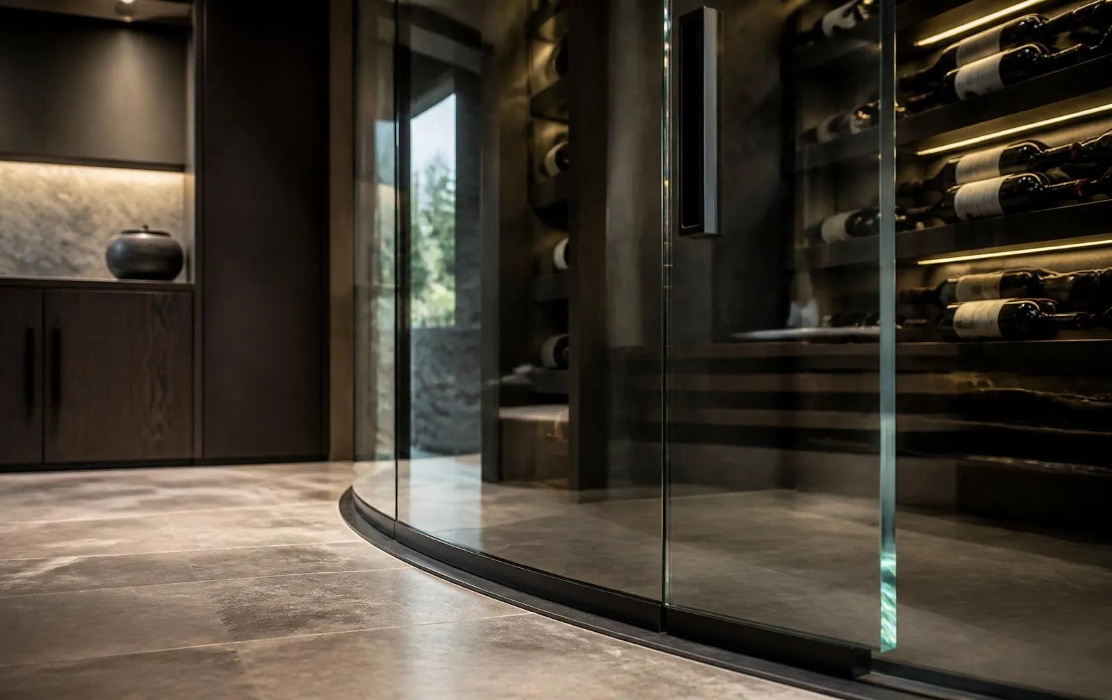 Design reference: curved frameless glass enclosure around a temperature-controlled wine display