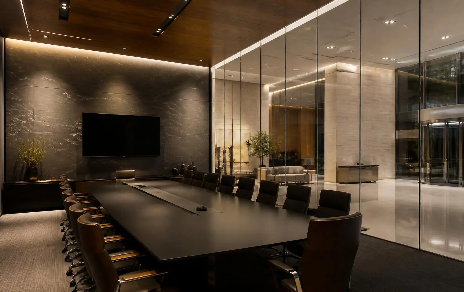 Design reference: an executive boardroom separated from a lit lobby by a frameless glass wall